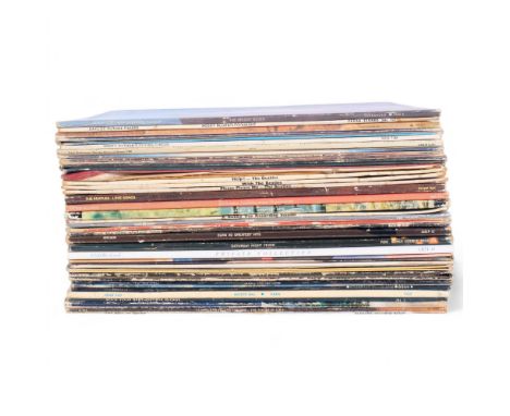 A mixed collection of 33 and 1/3 vinyl albums, including The Beatles Help, With The Beatles, Please Please Me, Love Songs, Th