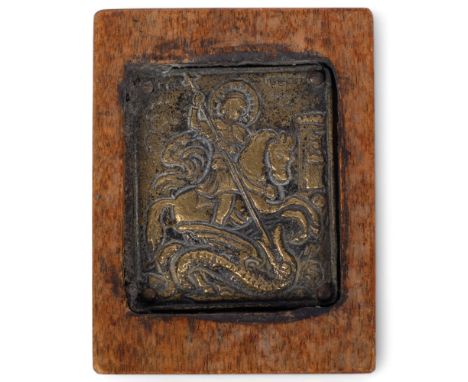 A small bronze travelling icon, depicting St George and The Dragon, framed, 9cm x 7cm overall