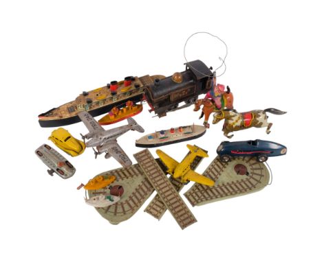 A collection of Vintage tinplate and painted wood toys, including a Tri-ang Minic Toys racing car, key-wind racing car, cowbo