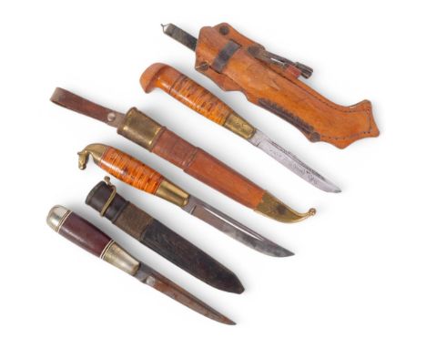 Lisakki Jarvenpaa, Finnish, a group of 3 Puukko hunting knives with leather sheaths