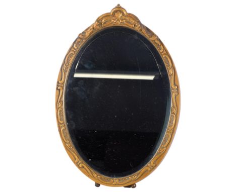 A Vintage oval bevel-edge strut mirror, with embossed gilt frame, H42cm