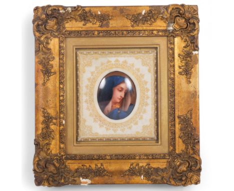 An Antique miniature oval watercolour on ceramic panel, depicting a young girl in a blue cape and hood, cushion frame surroun