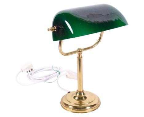 An adjustable brass desk lamp, with green glass shade, H35cm