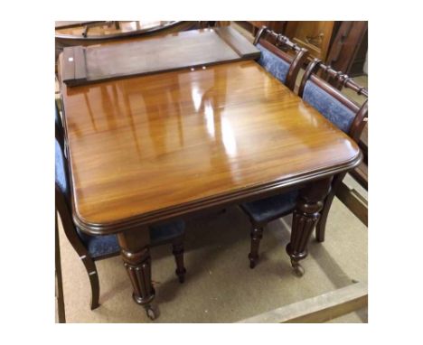 Victorian Mahogany extending Dining Table with moulded edge over a plain frieze and four reeded and balustered tapering suppo