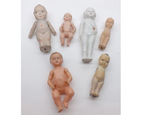 A Tray containing six assorted Dolls, to include two Celluloid Thumbs Up; Japanese All China Doll; Kewpie type Dolls etc (qty