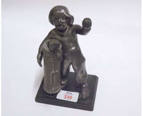 A vintage Base Metal Model of a Golfer's Caddy, 7" high 