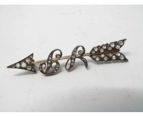 Cased precious metal bar Brooch in the form of an arrow set with rose cut Diamonds, Diamond set initials to the centre 'SP', 