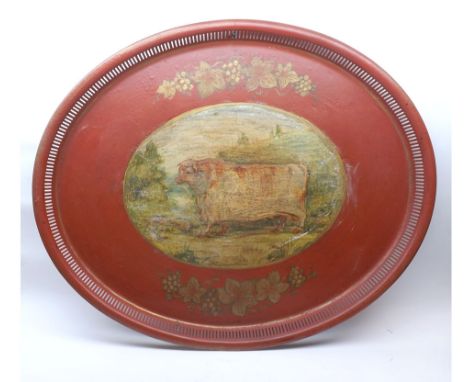 A Vintage Toleware Tray, the centre painted with na ve study of a bull, 24" wide 