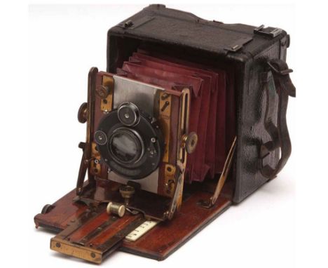 A late 19th/early 20th Century Sanderson's Patent Folding Bellow Box Camera with compure lens, together with leather carrying