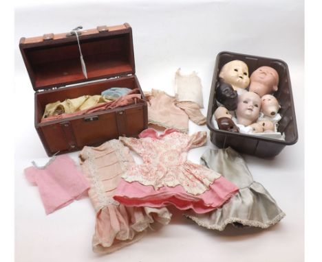 A small collection of assorted Bisque and Composition Doll Heads, together with a small trunk containing a quantity of dolls 