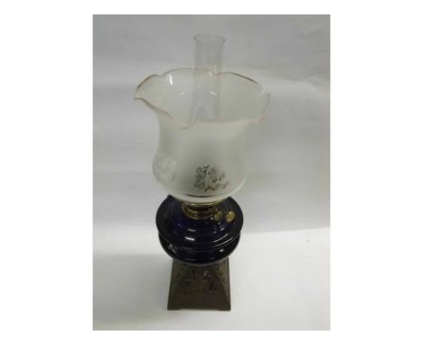 19th Century oil lamp with clear glass chimney, frosted glass shade, blue glass font and pierced cast metal base, 23" high in