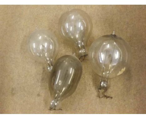 A collection of four vintage large light bulbs, all approx 10" high