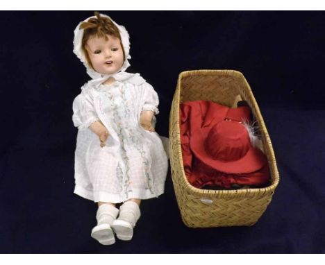 A mid-20th Century Composition Shoulder Plate Doll (restored/overpainted); together with a large basket containing a quantity