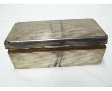 George V Silver encased rectangular Cigarette Box, engine turned decoration throughout, top measuring 7" x 3 1/2", damage thr