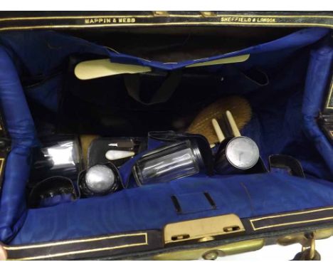 Victorian leather travelling case holding four matching Silver topped Dressing Table Jars, London 1881, and other items inclu