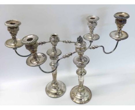A large pair of 19th Century electro plated (on copper) three-light Candelabra, plain circular loaded bases, fern applied tap