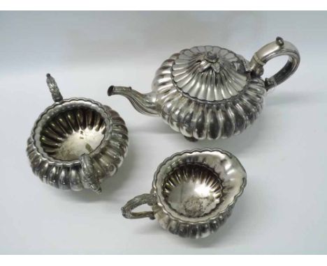 A late Regency three-piece electro plated (on copper) Tea Set of melon form, fluted decoration, wavy rims comprising Tea Pot,
