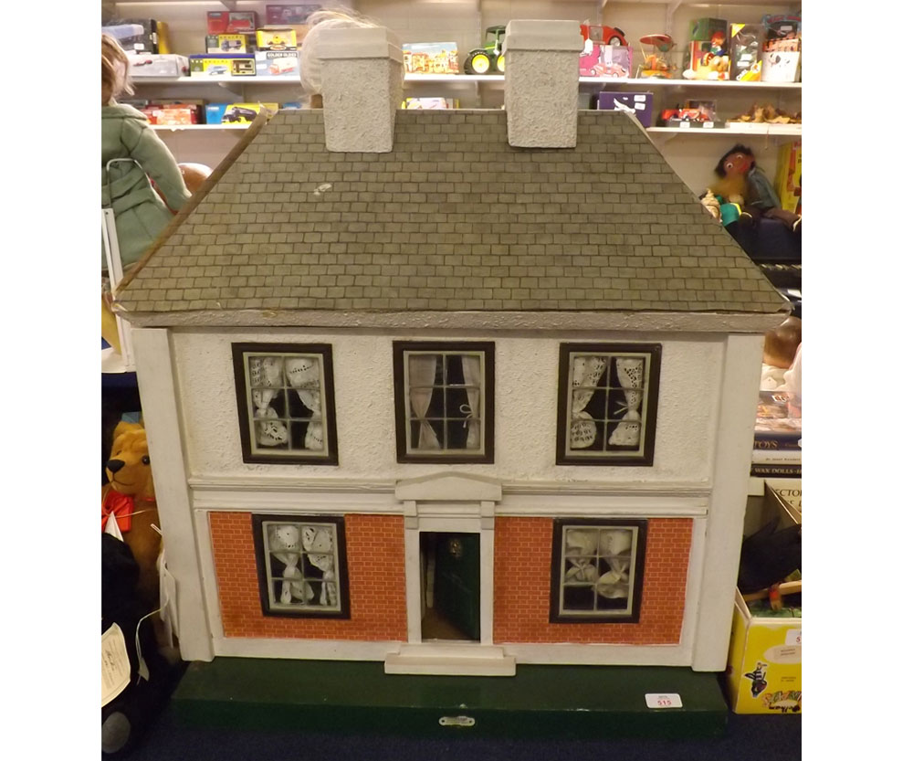 A mid20th Century Hamleys doll's house with single opening front