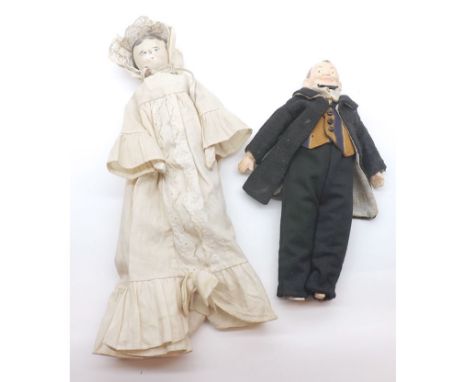 A Vintage Wooden Peg type Doll, together with a painted composition Gentleman Doll (2)   30-40