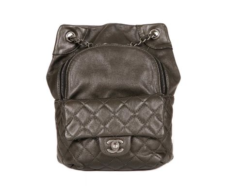 Chanel, a small drawstring backpack, crafted from metallic pewter leather, featuring antiqued silver-tone hardware, front qui