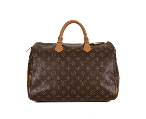 Louis Vuitton, a monogram Speedy 35 handbag, featuring the maker's monogram coated canvas exterior with natural tan leather p
