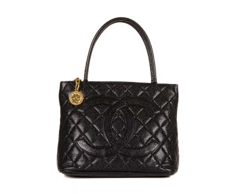 Chanel, a Timeless Medallion tote, crafted from black caviar leather with the maker's classic diamond quilting and large appl