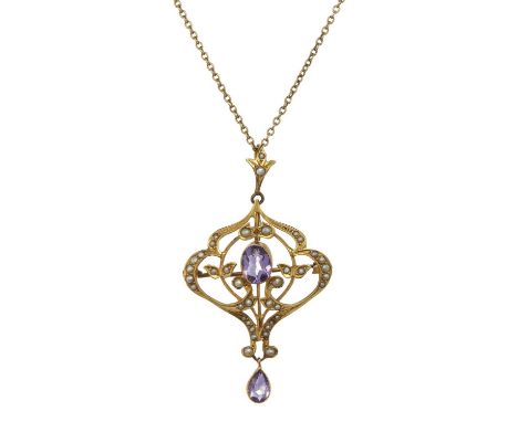 An Edwardian 9ct gold amethyst and pearl openwork pendant, suspended from a 9ct gold trace-link chain, stamped 9ct, length of