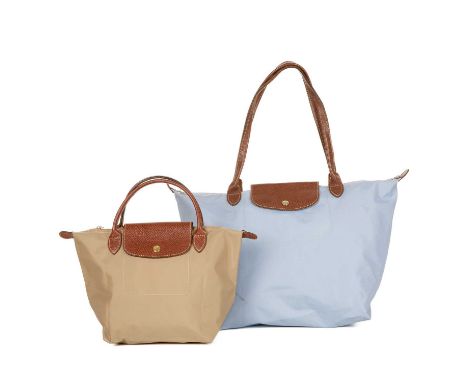 Longchamp, two Le Pliage handbags, to include a large light blue nylon shopping tote, together with a small beige nylon examp
