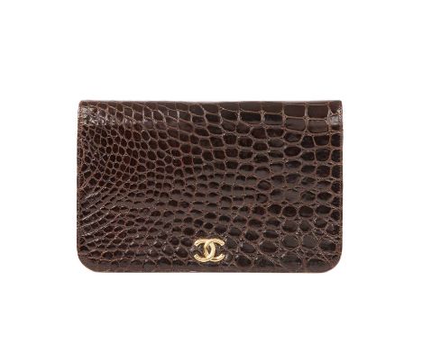 Chanel, a vintage crocodile handbag, crafted from glossy brown crocodile skin, featuring a gold-tone CC front plaque, chain a
