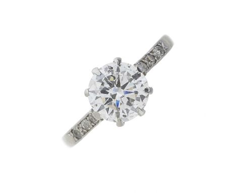 A mid 20th century platinum circular-shape diamond single-stone ring, with old-cut diamond line shoulders, principal diamond 