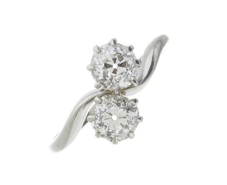 An early 20th century old-cut diamond two-stone crossover ring, estimated total diamond weight 1ct, G-H colour, VS2-SI1 clari