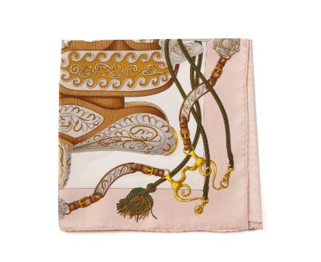 Hermes, a small Festival silk scarf, designed by Henri d'Origny in 1992 and features horse saddles used for festive occasions