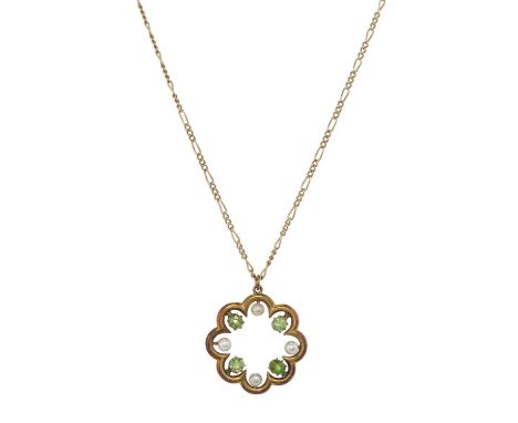 An early 20th century gold demantoid garnet and seed pearl pendant, with later 9ct gold figaro-link chain, clasp stamped 9ct,