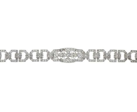 An Art Deco platinum old-cut diamond openwork panel bracelet, estimated total diamond weight 5.50ct, principal three diamonds