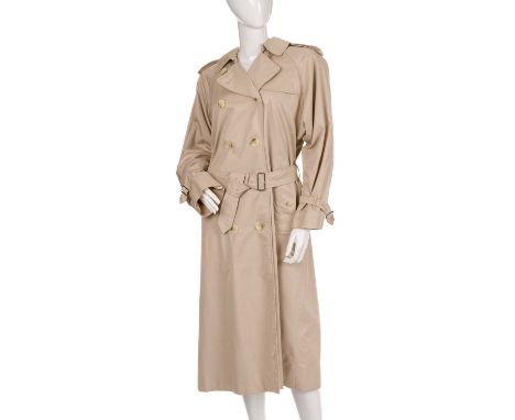 Burberry, a ladies classic trench coat, designed with a notched lapel collar, buttoned epaulettes, deep back yoke, double-bre