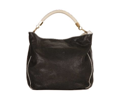 Yves Saint Laurent, a large Roady hobo handbag, crafted from black leather with contrasting white leather piping, rolled top 