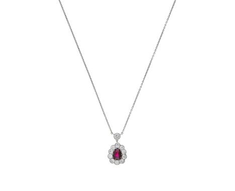 An early 20th century platinum ruby and old-cut diamond cluster pendant, with integral chain, ruby estimated weight 1ct, esti