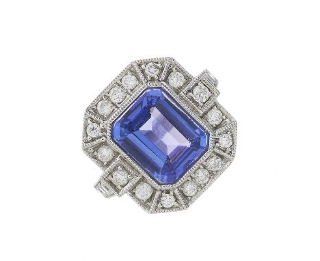 An 18ct gold tanzanite and diamond cluster dress ring, tanzanite estimated weight 3.25ct, estimated total diamond weight 0.40