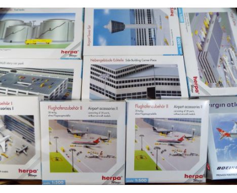 Herpa - a collection of 1:500 scale Herpa diecast buildings to include fuel tanks, multi-storey car park, airport tower set, 