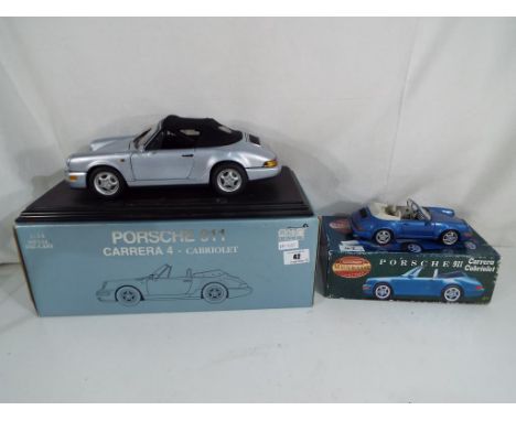 Diecast - two diecast models of Porsche motor vehicles to include a 1:14 scale model by Anson of a Porsche 911 Carrera 4 Cabr