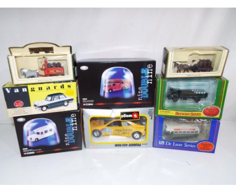 Diecast Models - a mixed lot of diecast model motor vehicles to include a Burago Peugeot 405 Raid code #0131, a Corgi Daimler