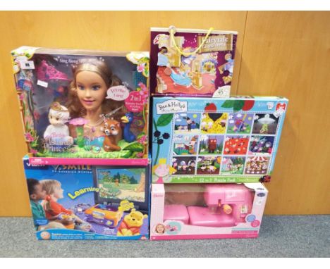 A quantity of children's activity toys to include a Barbie Island Princess hair styling model, a fairy tale floor puzzle, a B