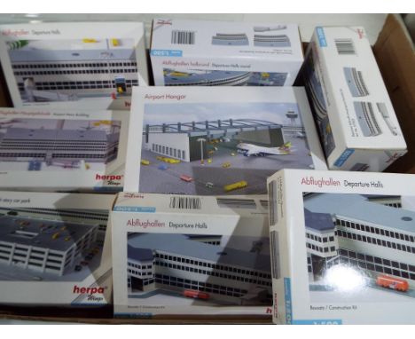 Herpa - a collection of Herpa diecast 1:500 scale buildings to include departure halls, airport main building, multi-storey c