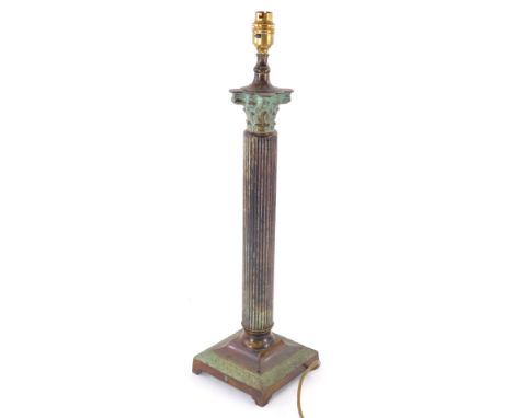 A Corinthian column table lamp, in hollow metal with shaped leaf outline and modern electrical fitting, 59cm high.