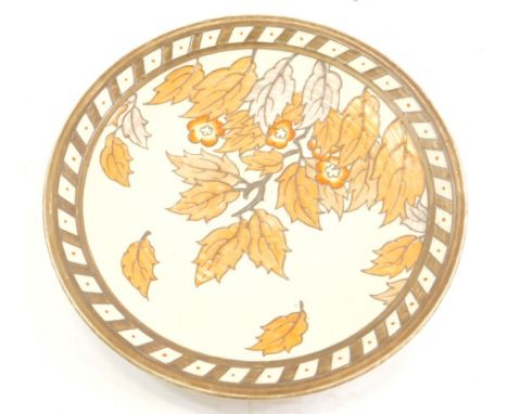 A 1930's Charlotte Rhead Crown Ducal charger, decorated with autumnal leaves, 32cm diameter.