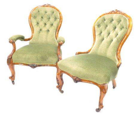 A pair of Victorian walnut show framed spoon back chairs, with green upholstered padded backs and seats, on cabriole legs, wi