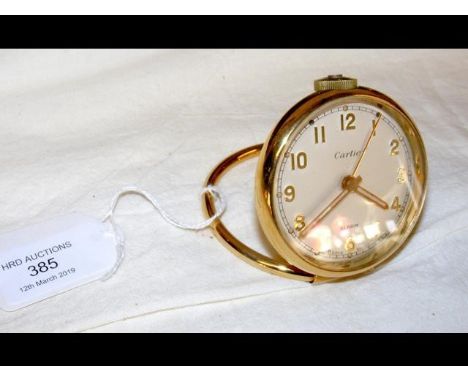 A Cartier travelling bedside clock with alarm CONDITION REPORTSlight surface scratches to back as per images; ticking order b