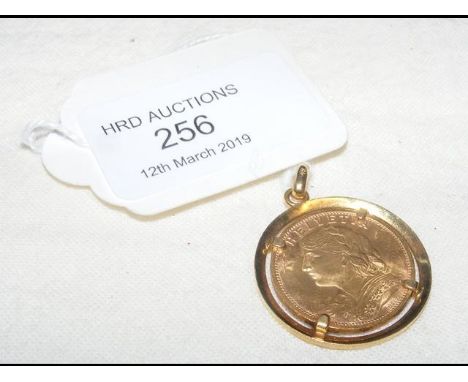 A 1935 gold coin in mount CONDITION REPORTApprox total weight - 9.4gms