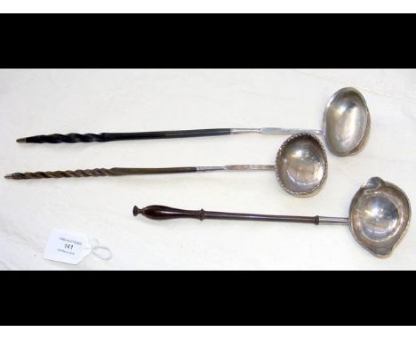 A horn handled silver toddy ladle, together with two others CONDITION REPORT1 is English hallmarked, other two white metal