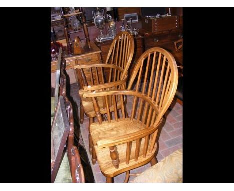 A pair of antique style stick back armchairs with crinoline stretchers 